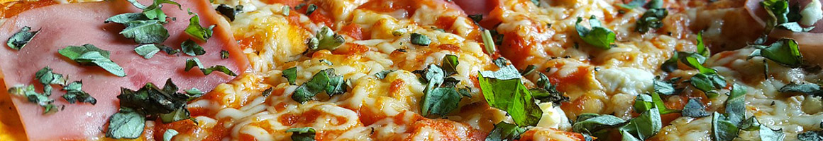 Eating Pizza at Bite of New York restaurant in Mukilteo, WA.
